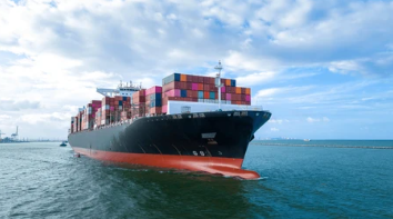 Cargo ship moving through the Strait of Hormuz 2026, image depiction